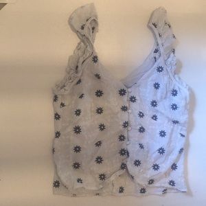 top with navy blue flower detailing